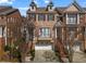 Beautiful brick townhome featuring a two-car garage and charming architectural details and balcony at 1029 Emory Parc Pl, Decatur, GA 30033