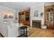 Beautiful living room with hardwood floors, a fireplace, and custom built-ins for storage and display at 1029 Emory Parc Pl, Decatur, GA 30033