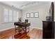 Bright office space with contemporary desk, plantation shutters, and polished wood flooring at 1029 Emory Parc Pl, Decatur, GA 30033