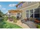 Inviting backyard patio with an umbrella, comfortable seating, and a lush green lawn at 1907 Haven Park Se Cir, Smyrna, GA 30080