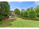 Beautiful home and backyard featuring an outdoor fireplace and patio at 1907 Haven Park Se Cir, Smyrna, GA 30080