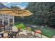 Outdoor patio with a table and chairs under a large umbrella at 1907 Haven Park Se Cir, Smyrna, GA 30080