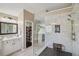 Bathroom with large glass shower, rain shower head, a vanity and a doorway to the walk-in closet at 1907 Haven Park Se Cir, Smyrna, GA 30080