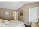 Bedroom with a queen bed, hardwood floor, and a door leading to the bathroom at 1907 Haven Park Se Cir, Smyrna, GA 30080