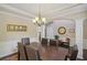 Elegant dining room with crown molding, hardwood floors, and a chandelier at 1907 Haven Park Se Cir, Smyrna, GA 30080