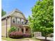 Inviting home exterior featuring stone accents, manicured landscaping, and a welcoming covered entry at 1907 Haven Park Se Cir, Smyrna, GA 30080