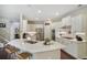 Bright kitchen with white cabinets, stainless steel appliances, quartz countertop, and bar stool seating at 1907 Haven Park Se Cir, Smyrna, GA 30080