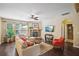 Comfortable living room with a stone fireplace, hardwood floors, and a ceiling fan at 1907 Haven Park Se Cir, Smyrna, GA 30080