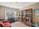 Home office with built-in bookshelves, a desk, and a comfortable chair, creating a productive and organized workspace at 1907 Haven Park Se Cir, Smyrna, GA 30080