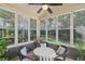 Cozy sunroom featuring lots of natural light and wicker furniture at 1907 Haven Park Se Cir, Smyrna, GA 30080
