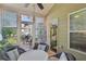 Bright sunroom with lots of windows, wicker furniture, and an outdoor view at 1907 Haven Park Se Cir, Smyrna, GA 30080