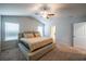 Bedroom featuring a plush bed, lots of natural light and neutral tones at 4700 Blake Loop, Atlanta, GA 30349