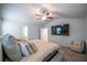 Bright bedroom features a ceiling fan, TV, and neutral color scheme at 4700 Blake Loop, Atlanta, GA 30349