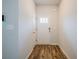 Bright entryway with hardwood floors and a white door with glass inserts at 4700 Blake Loop, Atlanta, GA 30349