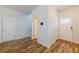 Bright entryway with hardwood floors and a white door with glass inserts at 4700 Blake Loop, Atlanta, GA 30349