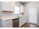 White kitchen featuring subway tile backsplash, quartz countertops, and stainless steel appliances at 4700 Blake Loop, Atlanta, GA 30349