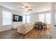 Cozy living room with a comfortable sectional sofa, dining area, and stylish hardwood floors at 4700 Blake Loop, Atlanta, GA 30349