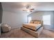 Spacious main bedroom with carpet, ceiling fan, and natural light from the windows at 4700 Blake Loop, Atlanta, GA 30349