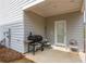 Home's covered patio with an outdoor grill and seating at 4700 Blake Loop, Atlanta, GA 30349