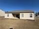 Backyard view with a covered patio, lawn, and house exterior at 8620 Blair Ct, Douglasville, GA 30134