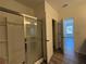 Walk-in shower with a glass enclosure and a tile surround at 8620 Blair Ct, Douglasville, GA 30134