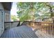 Exterior view of home's wooden back deck at 251 Waterford Cove Dr, Suwanee, GA 30024