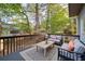 Back deck with outdoor furniture and patio seating at 251 Waterford Cove Dr, Suwanee, GA 30024
