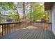 View of spacious back deck with wood railings, offering backyard views at 251 Waterford Cove Dr, Suwanee, GA 30024