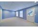 Bright basement with lots of natural light, recessed lighting, and neutral carpet at 251 Waterford Cove Dr, Suwanee, GA 30024
