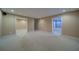 Unfurnished basement features multiple access points and neutral carpeting at 251 Waterford Cove Dr, Suwanee, GA 30024