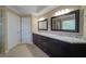 Bathroom featuring dual vanity sinks with granite countertops at 251 Waterford Cove Dr, Suwanee, GA 30024