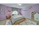 Stylish bedroom with a black and white rug, desk, and charming decor at 251 Waterford Cove Dr, Suwanee, GA 30024