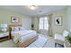 Comfortable and clean bedroom with large window that lets in plenty of natural light at 251 Waterford Cove Dr, Suwanee, GA 30024