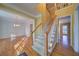 Inviting foyer with hardwood floors and staircase leading to the upper level at 251 Waterford Cove Dr, Suwanee, GA 30024
