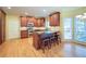 Open kitchen design with seating area, granite countertops, and stainless steel appliances at 251 Waterford Cove Dr, Suwanee, GA 30024