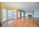 Spacious living room features hardwood floors, fireplace, and large windows offering plenty of natural light at 251 Waterford Cove Dr, Suwanee, GA 30024