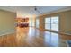 Expansive living room with hardwood floors, leading to the kitchen and backyard patio at 251 Waterford Cove Dr, Suwanee, GA 30024