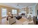 Comfortable living room with fireplace, built-in shelves, and neutral furniture at 251 Waterford Cove Dr, Suwanee, GA 30024