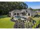 Aerial view of a backyard with a pool, spa, and lush landscaping, perfect for luxurious outdoor living and entertaining at 3085 Lake Park Dr, Jonesboro, GA 30236