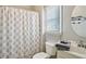 Cozy bathroom with shower and tub featuring gray accents at 2064 Democracy Dr, Buford, GA 30519