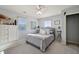 Bedroom features soft gray tones, a ceiling fan, and neutral decor at 2064 Democracy Dr, Buford, GA 30519