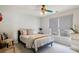 Charming bedroom with a ceiling fan, large windows, and neutral color scheme at 2064 Democracy Dr, Buford, GA 30519