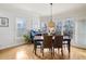 Charming dining area featuring hardwood floors, lots of windows, and access to the outdoors at 2064 Democracy Dr, Buford, GA 30519