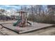 Community playground with slides, swings, and ample play space, great for outdoor fun and recreation at 2064 Democracy Dr, Buford, GA 30519