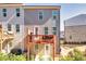 Exterior view of a townhouse with a balcony and small yard at 399 Skylar Se Way, Atlanta, GA 30315