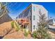 Backyard view of townhomes featuring wood decks, patios, and landscaping on a sunny day at 399 Skylar Se Way, Atlanta, GA 30315