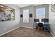 Bedroom with carpet flooring, two windows with blinds and an accenting painting hanging on the wall at 399 Skylar Se Way, Atlanta, GA 30315