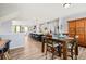 Dining area features a view of the kitchen island with bar stools and ample natural light at 399 Skylar Se Way, Atlanta, GA 30315