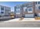 New townhouses showcase two-car garages and brick facade, complemented by a lush, landscaped setting at 399 Skylar Se Way, Atlanta, GA 30315