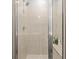 Tiled walk-in shower features a shower head and built-in shelves at 399 Skylar Se Way, Atlanta, GA 30315